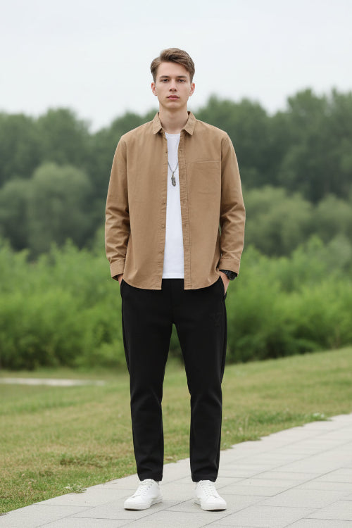 Brown button-up shirt worn by a person on a gray background