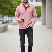 Pink long-sleeve shirt with brown accents on a white background