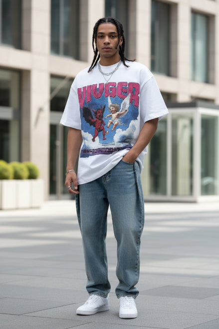 Person wearing a white t-shirt with a graphic design featuring an angel and devil and the word 'HUGER'.