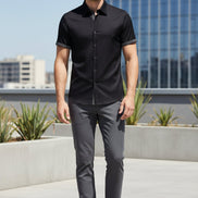 Black short-sleeve shirt with patterned trim on a white background