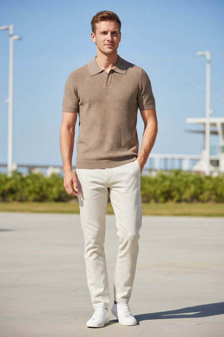 Brown short-sleeve polo shirt on a hanger against a gray background