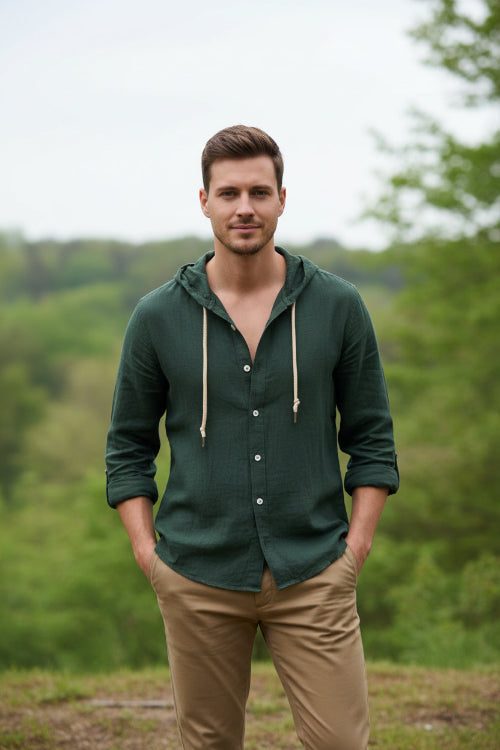 Dark green hoodie with button details on a white background