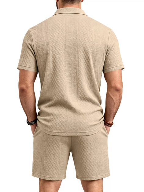 A man viewed from the back wearing a beige short-sleeve polo shirt and matching shorts, 