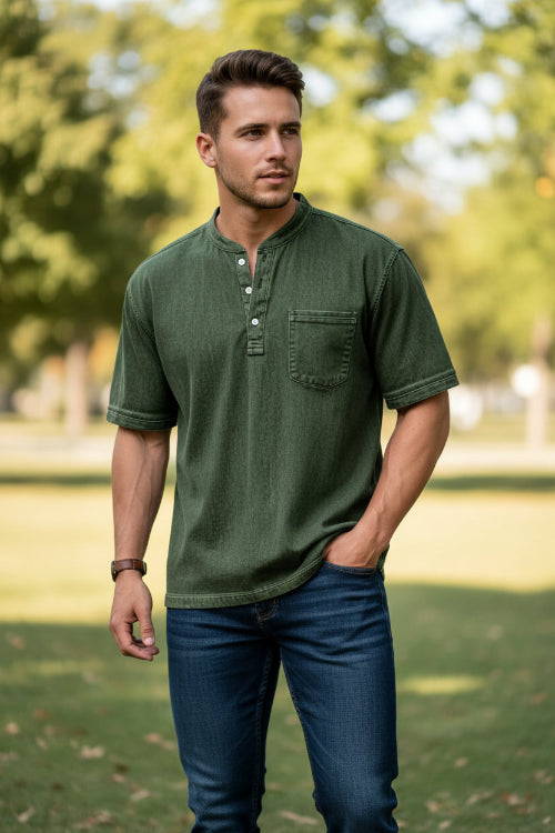 Green short-sleeve henley shirt worn by a person on a white background