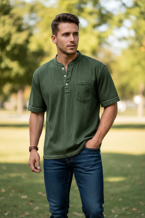 Green short-sleeve henley shirt worn by a person on a white background