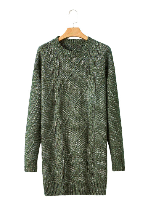 Green cable knit sweater on a wooden hanger against a white background