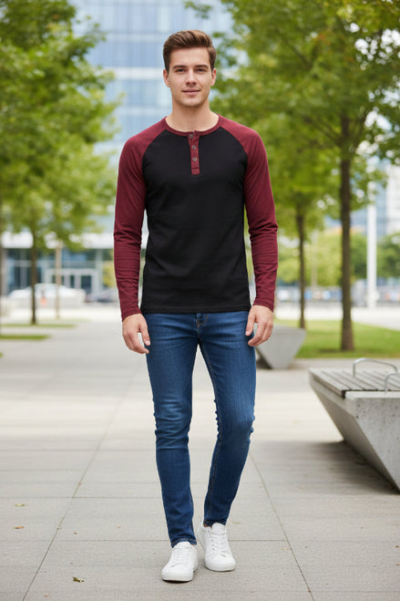 Black and burgundy long-sleeve shirt with button details on a white background