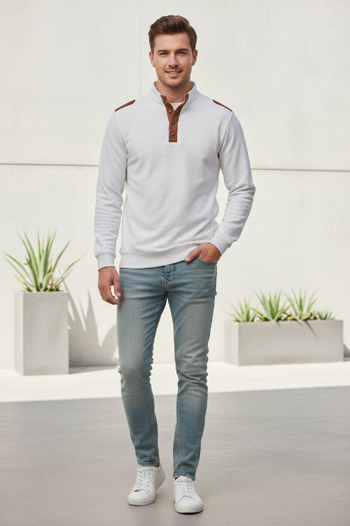 White shirt with brown leather accents on a gray background