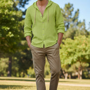 Green hoodie with button details on a white background