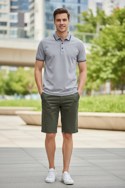 Gray polo shirt on a hanger against a white background
