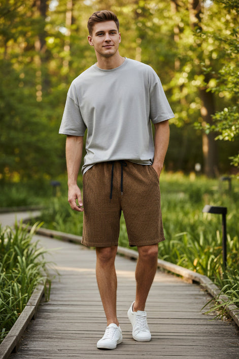 Brown checkered shorts with drawstring on a white background
