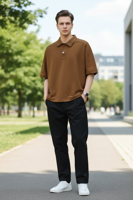 Brown polo shirt worn by a person on a white background