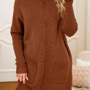 Woman wearing a brown knitted dress with pockets indoors.