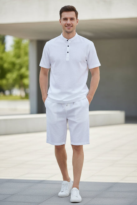 White shirt and pants set on hangers against a white background