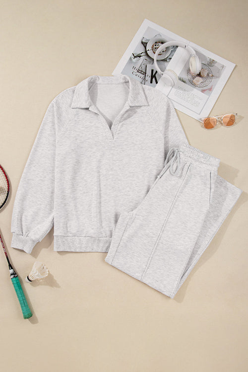 Gray pajama set with a tennis racket and shuttlecock on a beige background