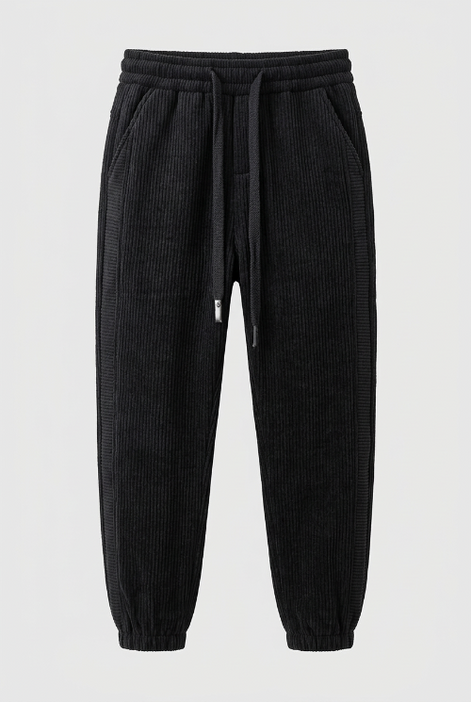 Black baggy sweatpants with a drawstring waist and cuffed ankles, shown against a plain studio background.